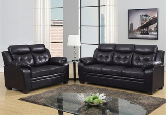 black leather couch and loveseat with coffee table display